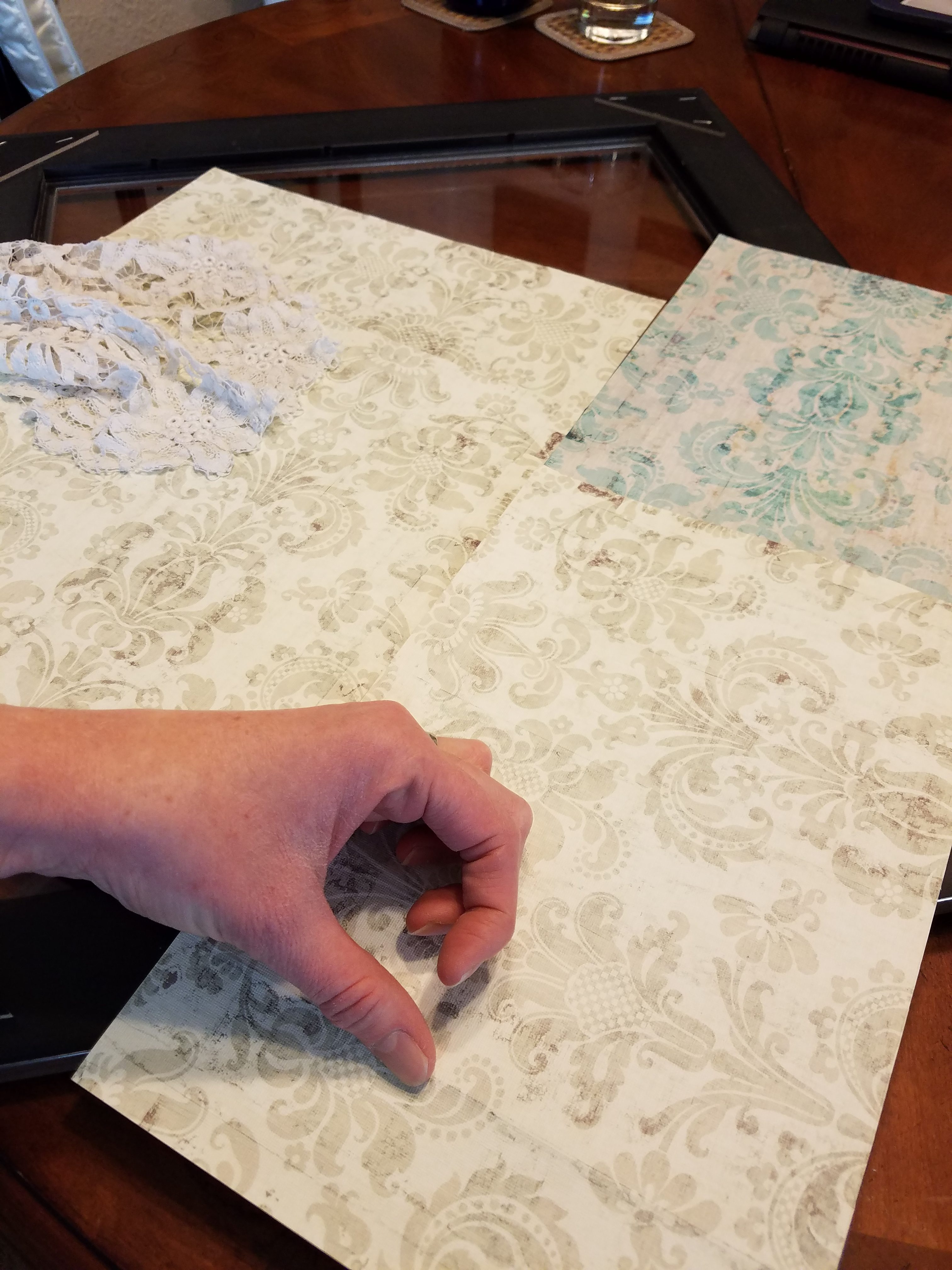 Score the paper along the edges of the mounting surface.